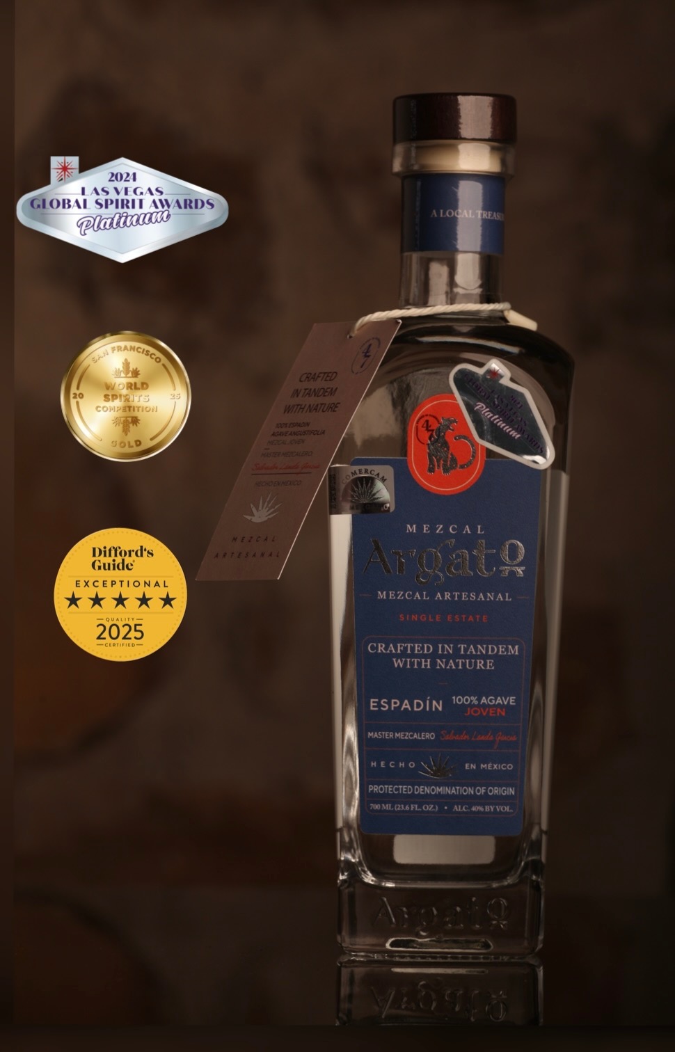 Mezcal Argato Espadin bottle alongside Las Vegas Global Spirit Awards Platinum 2024, San Francisco World Spirits Competition Gold 2025, and Difford's Guide 5-star Exceptional 2025 award badges