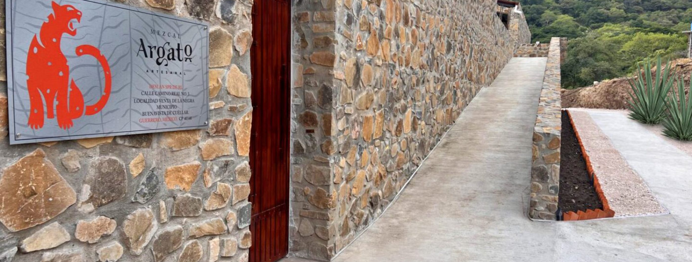 A stone wall with a sign on it